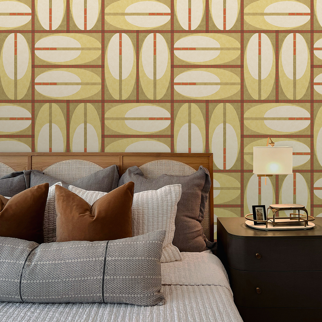 The artwork features a repeating geometric pattern of symmetrical shapes resembling elongated, curved diamonds or petals in various shades of blue and green. Each shape is split vertically with one half filled with a light blue and the other half filled with green or darker blue. The background is a light, almost pastel blue, which provides a soft yet vibrant backdrop. One of the blue shapes near the upper left contains a white starburst element, adding a focal point of brightness to the composition. The overall design conveys a modern, mid-century aesthetic with clean lines and harmonious color contrasts.